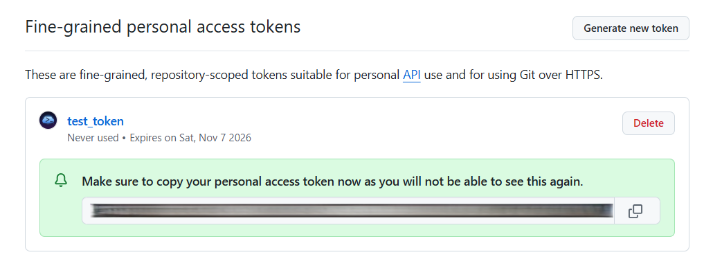 The new token shown once, with a copy button.